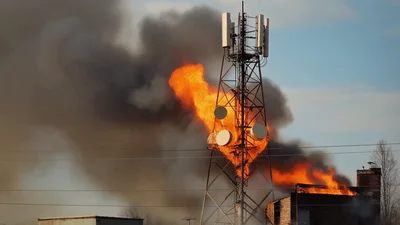 Cell Tower And Adjacent Building Engulfed In Intense Fire