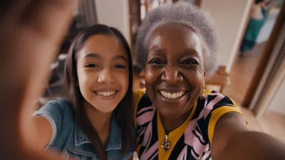 Young Girl And Grandmother Taking A Selfie Together