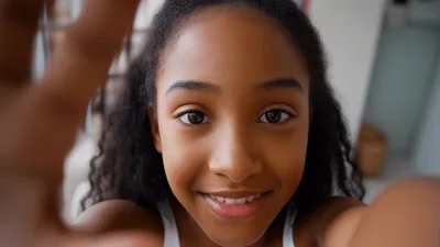 Young Girl Taking A Selfie With Her Hand Outstretched