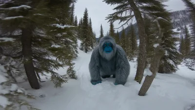 Yeti Walking Through Snowy Forest Towards Camera