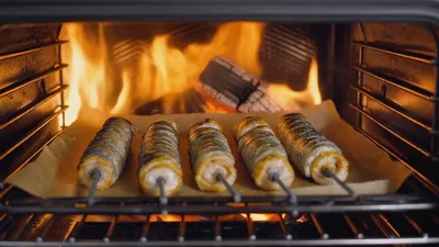 Skewered Corn Cobs Roasting Inside Wood Fired Oven