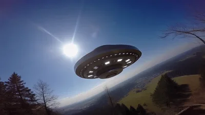 UFO Flying Over Mountain Landscape