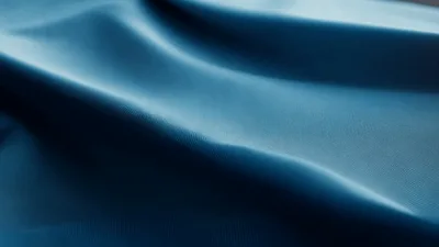 Close Up Of Smooth Teal Fabric Waving
