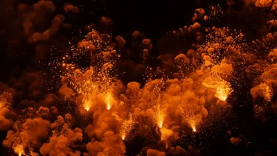 Intense Golden Fireworks Exploding Against Dark Night Sky