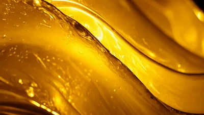 Abstract Golden Liquid Flowing In Smooth Waves