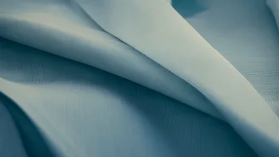 Soft Light Blue Fabric Draping In Gentle Waves
