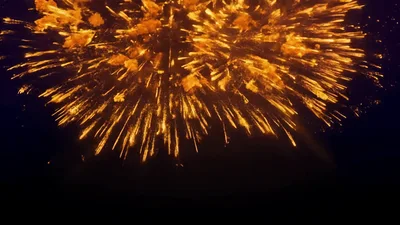 Golden Fireworks Exploding Against Dark Night Sky