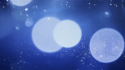 Abstract Blue Background With Floating Bokeh Light Particles