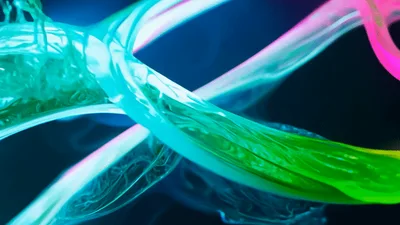 Abstract Neon Fluid Streams Swirling In Dark Space
