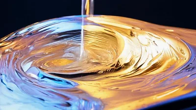 Water Pouring Into A Circular Metallic Surface
