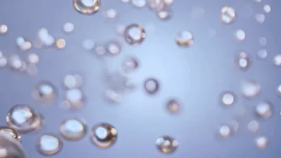 Floating Iridescent Liquid Spheres Moving In Space