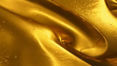 Liquid Gold Flowing With Bubbles And Ripples