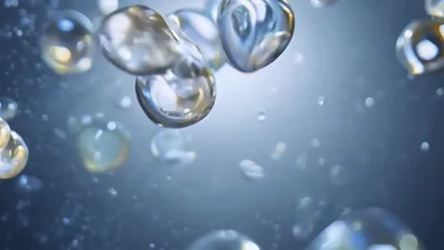 Floating Iridescent Liquid Spheres In Motion