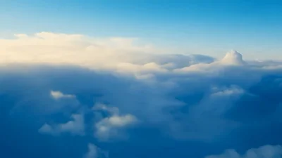 Aerial View Flying Over Dense White Clouds