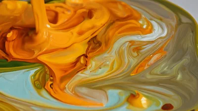 Yellow And Orange Paint Pouring On White Canvas