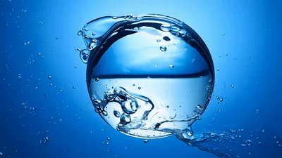 Large Water Sphere Floating In Blue Background