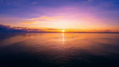 Aerial View Of A Vibrant Sunset Over The Ocean