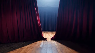 Red Velvet Theater Curtains Opening On Empty Stage