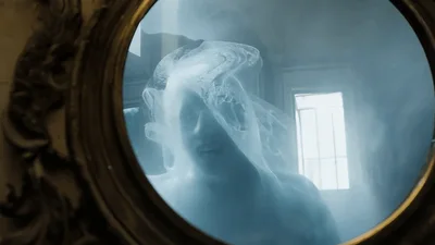 Ghostly Figure Appearing In An Antique Ornate Mirror