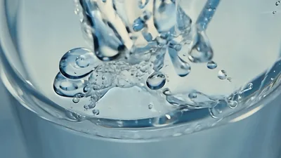 Clear Water Pouring Into A Glass