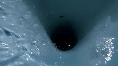 Water Flowing Down A Deep Vertical Pipe