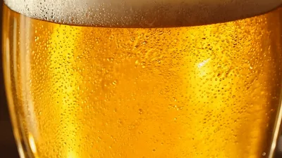 Golden Beer Pouring Into A Glass