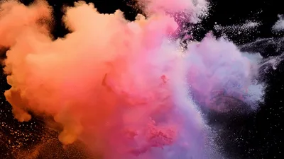 Colorful Powder Explosion Against A Black Background