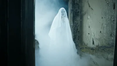 Ghostly Woman In White Veil Appearing In Abandoned Building