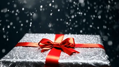 Silver Gift Box Under Falling Snow