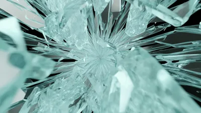 Shattered Glass Shards Exploding Outward In Slow Motion