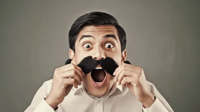 Surprised Man With Large Fake Mustache Holding His Collar