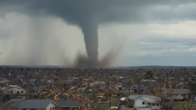 Large Tornado Moving Across Devastated Residential Neighborhood