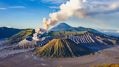 Mount Bromo Volcano Erupting Smoke Over Volcanic Landscape
