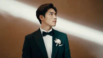 Handsome Groom Posing In A Formal Tuxedo