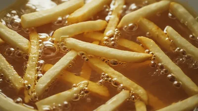 French Fries Deep Frying In Hot Oil