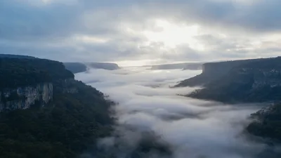 Aerial View Of Foggy Canyon At Sunrise