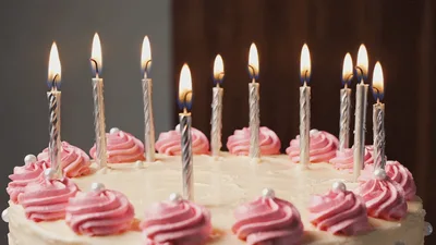 Birthday Cake Candles Burning Down On Decorated Cake