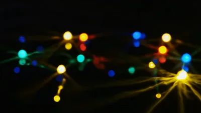 Colorful Bokeh Christmas Lights Blinking In Darkness