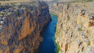 Aerial View Of Deep Canyon With Blue River