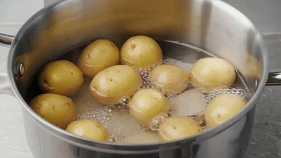 Small Yellow Potatoes Boiling In A Stainless Steel Pot