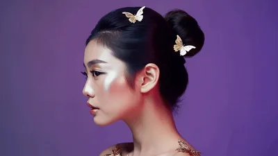 Portrait Of A Young Asian Woman With Butterfly Hair Accessories