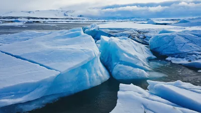 Large Blue Icebergs Floating In Jökulsárlón Glacier Lagoon