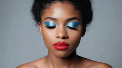 Beautiful Young Woman With Blue Eyeshadow Blinking