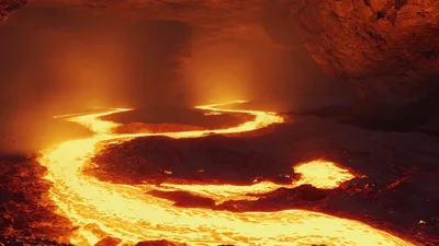 Molten Lava Flowing Through A Dark Volcanic Cave