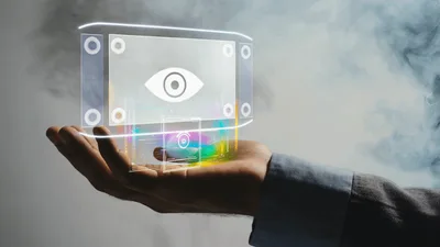 Holographic Eye Icon Floating Above Human Hand
