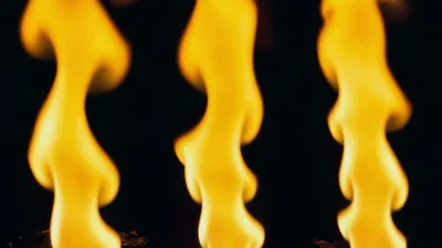 Three Vertical Columns Of Bright Yellow Flames