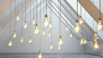Hanging Light Bulbs Gradually Turning On In Attic