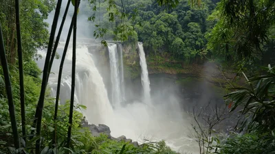 Powerful Athirappilly Waterfall Cascading Through Lush Tropical Forest