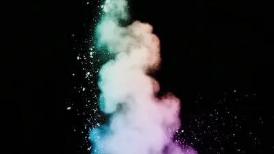 Colorful Powder Explosion Against A Black Background