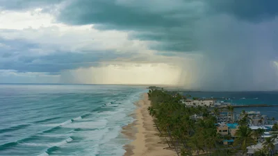 Aerial View Of Tropical Beach With Approaching Rain Storm